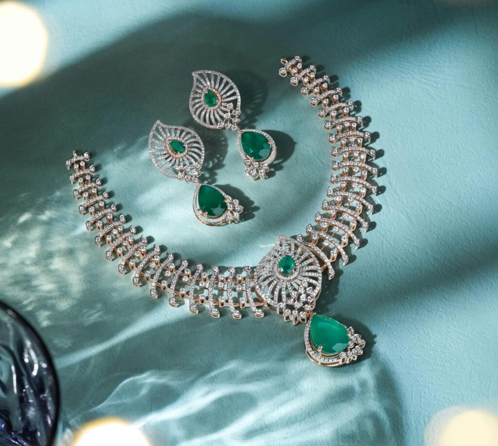 Dazzling diamond and emerald jewelry set beautifully showcased, perfect for festive occasions.